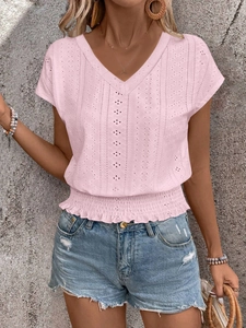 Detailed view of pink V-neck top with hollow embroidery and elastic shirred waist