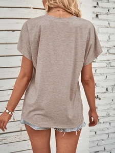 Detail view of the gray knit texture and relaxed shoulder fit on a casual short sleeve T-shirt
