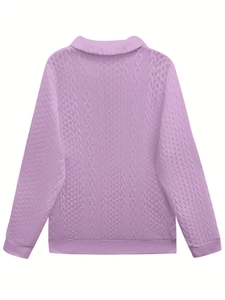 Macro detail of the lavender cable knit texture and retro polo collar on the casual sweater