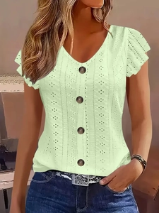Close-up of light green eyelet V-neck top with button detail and ruffle sleeves
