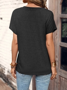 Detail view of the back of a dark grey short sleeve T-shirt with soft cotton texture