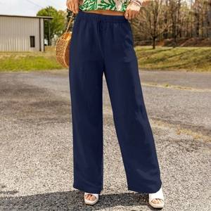 Detail of navy blue wide-leg linen pants with elastic drawstring waist and side pockets