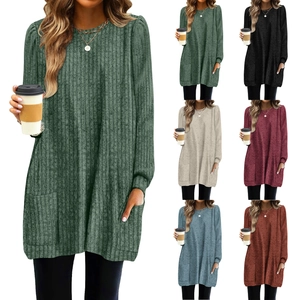 Detail view of ribbed knit texture and front pockets on a loose long-sleeve casual tee shirt