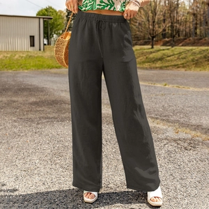 Detail of high-waisted linen wide-leg pants in dark grey with elastic drawstring waist