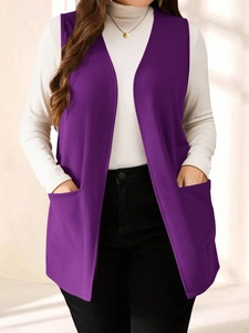 Detail of dark purple sleeveless vest jacket with large pockets and open front design