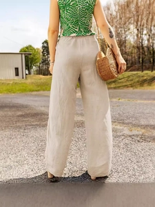 Women's beige wide-leg cotton linen trousers featuring elastic waist and relaxed fit design