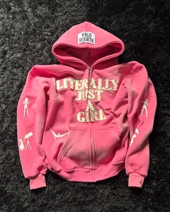 Detail of pink Y2K zip-up hoodie featuring 3D letter patches and female silhouette prints