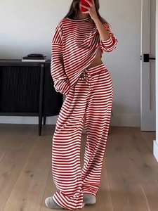 Detail of red and white striped long sleeve top and high-waist drawstring trousers set
