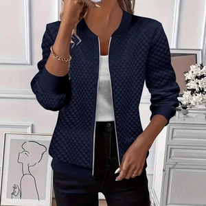 Women's navy blue quilted zip jacket with slim fit design and diamond pattern textures