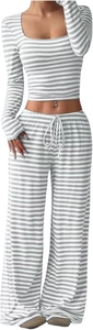 Detailed texture of women's ribbed knit striped crop top and wide-leg trousers