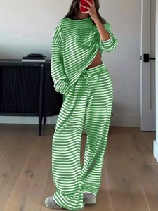 Detailed view of green and white striped long sleeve top with matching wide leg pants