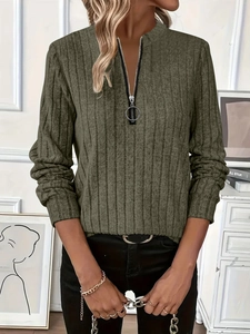 Detail of army green ribbed knit sweater with stand collar and metal ring zipper pull