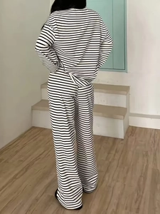 Back view of a black and white striped casual set with long sleeves and wide leg pants