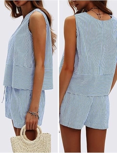 Detailed view of the striped sleeveless top and matching shorts for women in blue and white