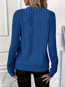 Detail of blue ribbed knit long sleeve sweater showing slim fit texture from the back