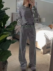Detailed view of striped pajamas set with drawstring waist and loose-fit lounge pants