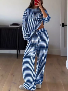 Detail of blue and white striped lounge set with drawstring hem and wide leg pants