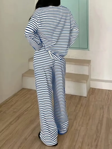 Detail of blue and white striped long sleeve top and wide leg pants back view