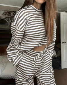 Detail of striped long-sleeve crop top and drawstring pants set in brown and white