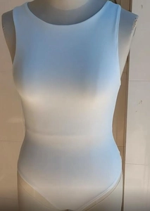 Close-up of white crew neck sleeveless bodysuit in stretchy slim fit fabric on mannequin