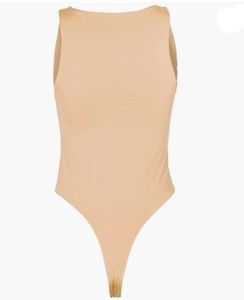 Close-up of nude sleeveless bodysuit featuring a round neck and smooth elastic fabric