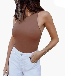 Detail of a brown sleeveless racerback bodysuit paired with high-waist white denim jeans
