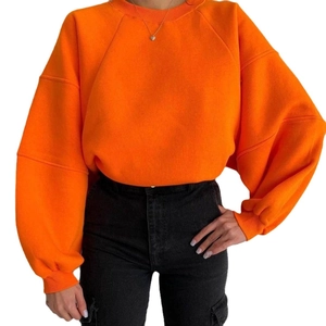 Oversized bright orange crew neck sweatshirt for women with drop shoulder and loose fit