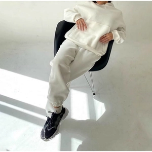 Detail of off-white oversized hoodie and jogger set in premium thick cotton fabric