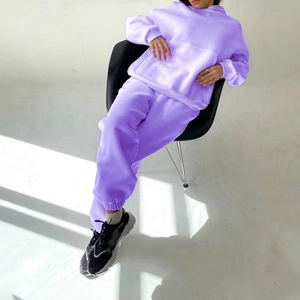 Women's lavender two-piece tracksuit featuring a hooded sweatshirt and joggers