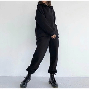 Detail view of premium black oversized hooded tracksuit with matching jogger pants for women