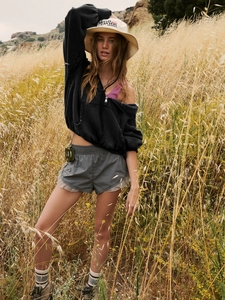 Outdoor leisure style set with black cropped zip hoodie and wide-leg shorts