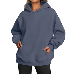 Detail of greyish-blue oversized hoodie featuring dropped shoulders and kangaroo pocket