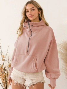 Detail of mauve half-zip hoodie with drawstring and loose drop-shoulder fit