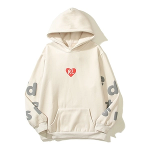 Cream oversized hoodie with red heart print and bold sleeve lettering in street style