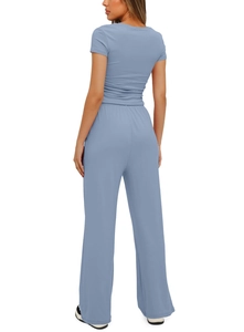 Detail of blue two-piece set featuring short sleeve top and high waist wide leg pants