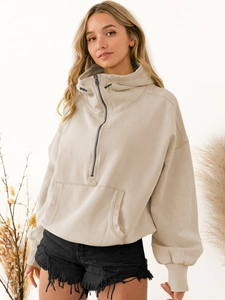 Detail of beige half-zip hoodie with adjustable drawstring and front kangaroo pocket