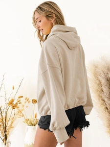 Oversized beige hoodie with dropped shoulders and ribbed cuffs for a casual look