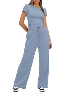 Detail of light blue leisure set featuring side drawstring ruched top and high waist pants