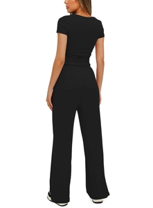 Back view detail of black two-piece set featuring short sleeve top and wide leg trousers