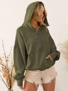 Detail of olive green half-zip hoodie featuring a kangaroo pocket and drawstring hood