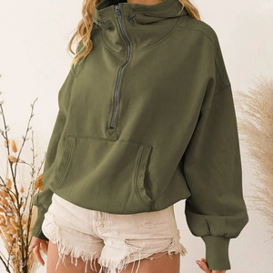 Detailed view of olive green half-zip hoodie with drawstring high neck and kangaroo pocket