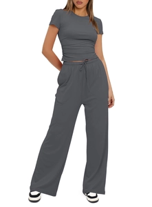 Detail of dark grey women's 2-piece set featuring ruched short sleeves and high waist pants