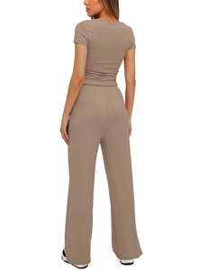 Rear view of two-piece lounge set featuring a short sleeve top and high waist wide leg pants
