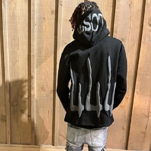 Oversized black hoodie with gothic foam printed grey graphic on the back and hood