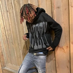 Gothic foam print black oversized hoodie with grey lettering in American street style