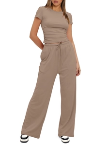 Detail of the side drawstring ruched waist on a brown short sleeve top and wide leg pants