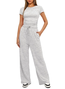 Detail view of high waist wide leg pants with functional side pockets and drawstrings