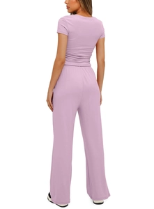 Detail view of lavender short sleeve top and high waist wide leg pants set from behind