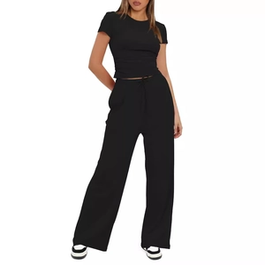Women's two-piece lounge set with short sleeve top and high waist wide leg pants in black