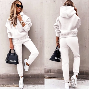 Women's white two-piece sweatsuit with long sleeve hoodie and matching joggers